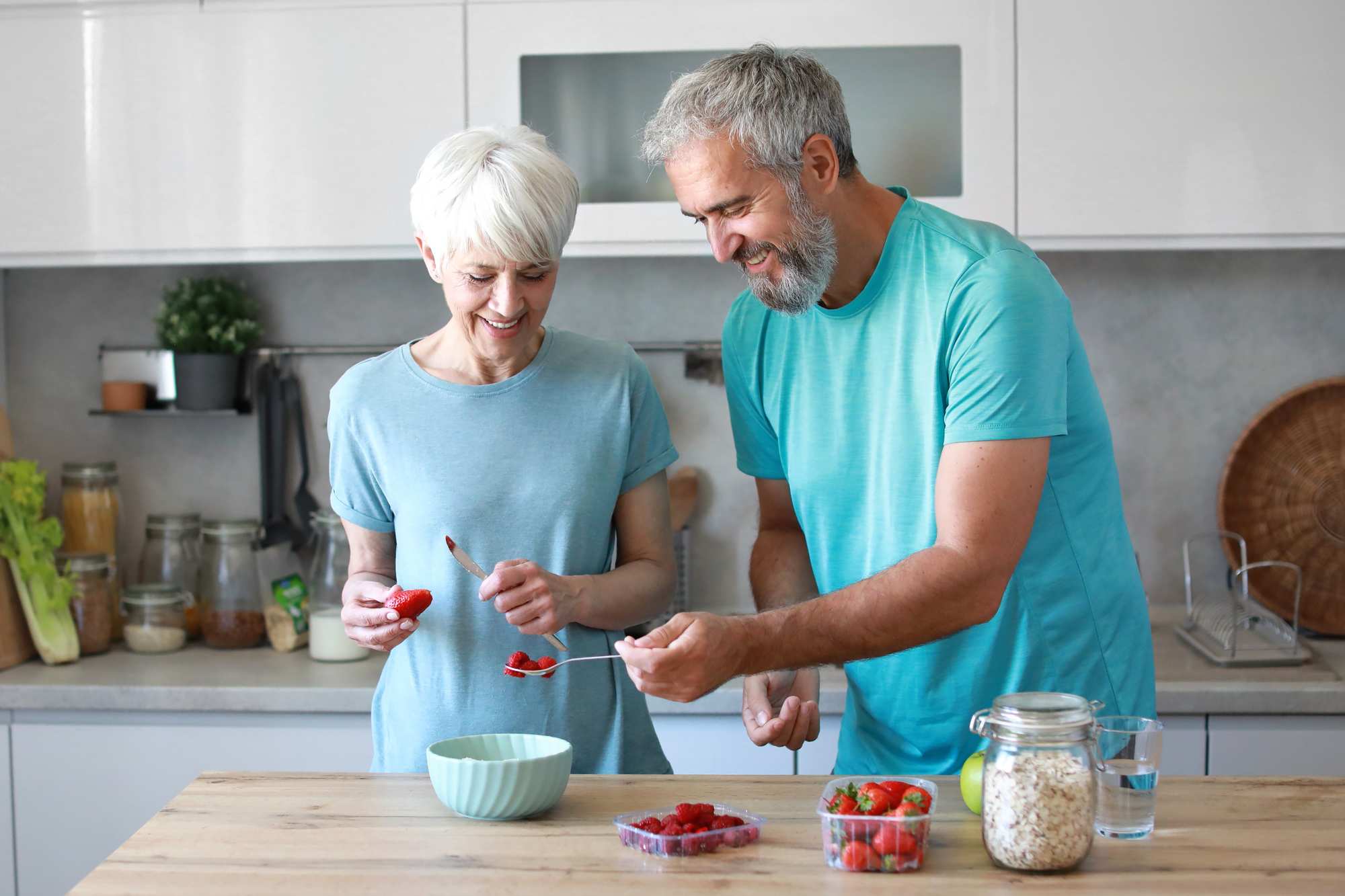 older couple making breakfast - kitchen